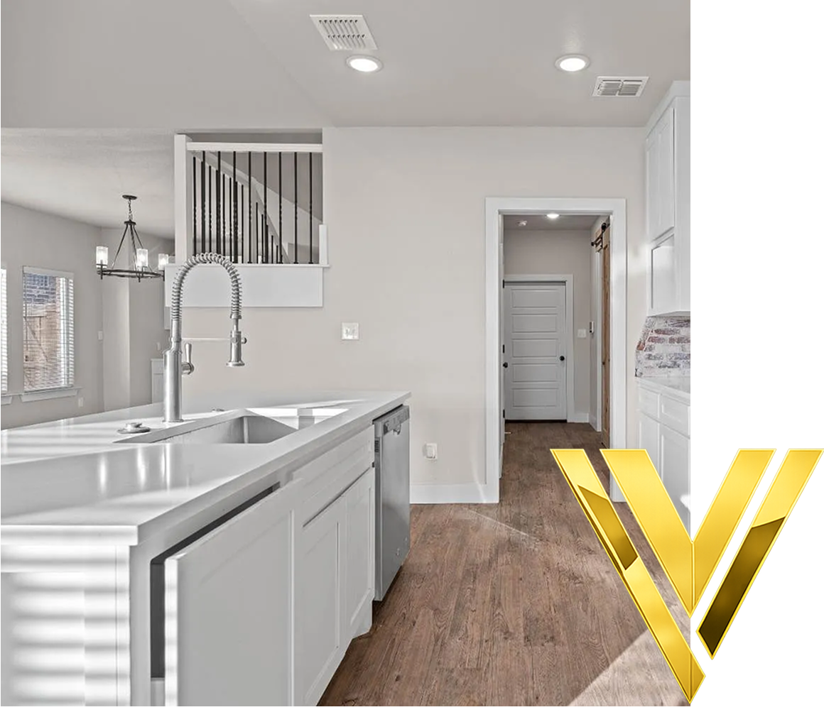 Modern kitchen with white cabinets and island.