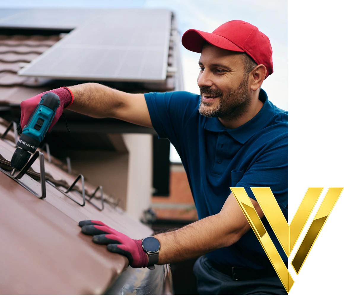 Man installing solar panels on roof.