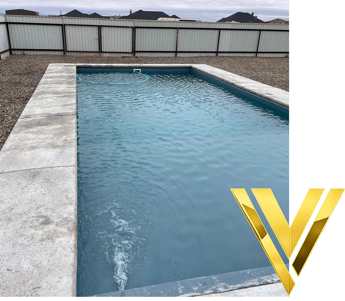 Rectangular pool with surrounding fence.